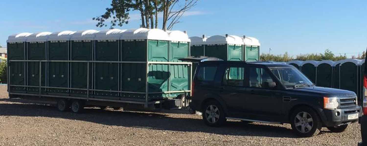 Any occasion green event toilets on trailer being towed