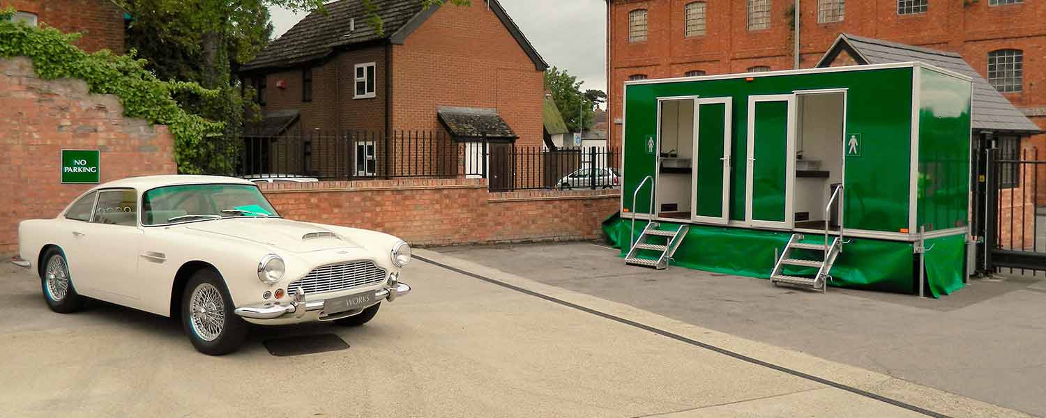 Any occasion luxury toilet trailer with white Aston Martin outside