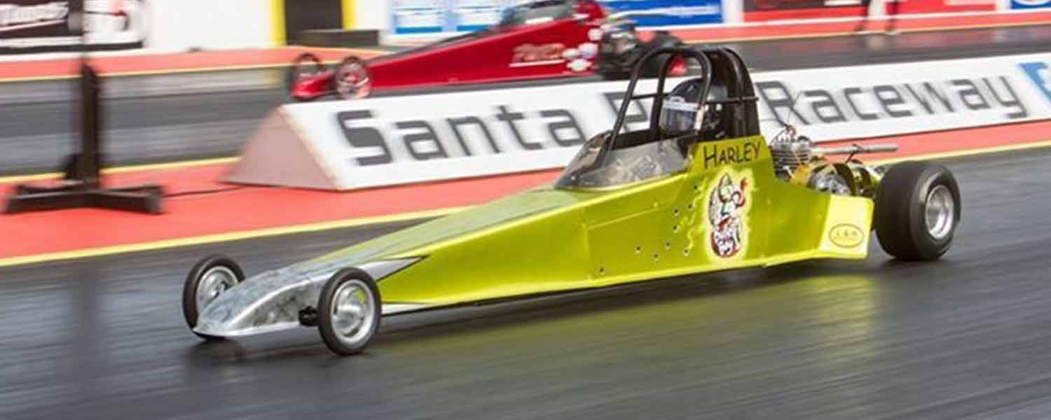 Gold drag car raceing at Santa pod